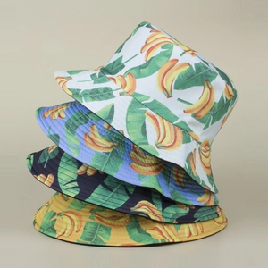 Reversible bucket hat with tropical banana print available in four vibrant summer colors