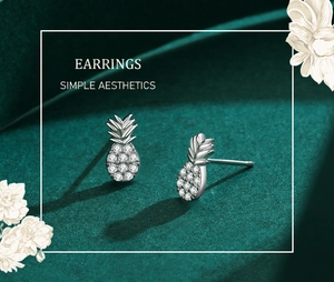 Macro shot of s925 silver pineapple stud earrings with pavé-set shimmering cubic zirconia