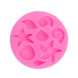 Pink silicone seashell and starfish mold for ocean themed cake decoration and baking