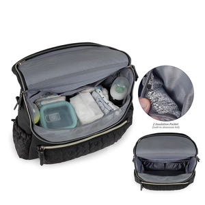 Internal view of black quilted baby bag showing large capacity for diapers and bottles