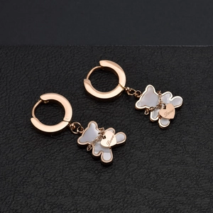 Cute rose gold bear and heart drop earrings with white shell inlay on black background