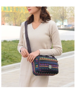 Ethnic style canvas crossbody bag with colorful stripes and multiple zipper pockets