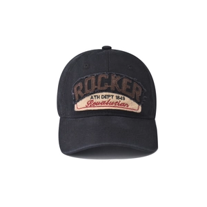 Detail of Rocker embroidery on vintage washed cotton baseball cap with textured stitching
