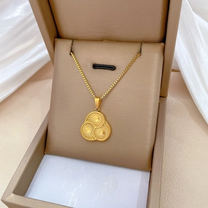 Gold titanium steel box chain necklace with triple interlocking circle pendant on silk