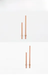 Detail view of model 281 rose gold aluminum clock hands showing hour and minute needles