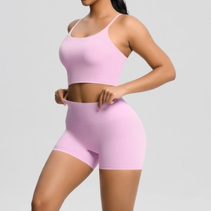 Close-up of pink sports bra and high-waisted shorts with soft brushed texture