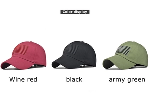 Detailed view of distressed cotton baseball caps in wine red, black, and army green colors