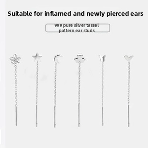 Macro detail of six S999 silver tassel earrings with flower star and heart charms