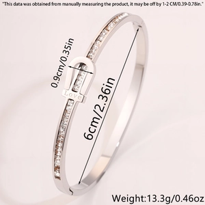Detailed view of silver love engraved bangle with dimensions 6cm diameter and 0.9cm width