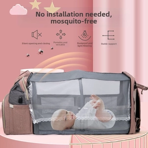 Multifunctional diaper bag expanding into a portable crib with mosquito net and USB port