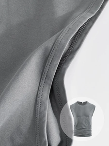 Close-up of gray cotton vest fabric showing precise double-needle stitching detail