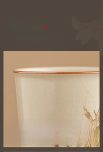 Detailed macro view of Ru Kiln ceramic teacup with ice-crack glaze and cat painting