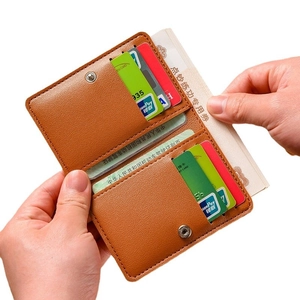Brown slim bifold wallet for women with pebble leather texture and multiple card slots