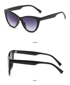 Detail view of black cat-eye sunglasses with purple gradient lenses from side and back angles
