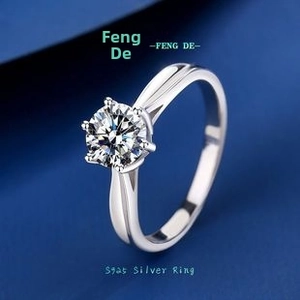 Close-up of classic six-prong s925 silver moissanite ring with polished finish