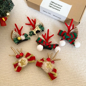 Christmas plush reindeer antler hair clips with velvet bows and festive gold stars