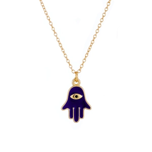 Close-up of golden Hamsa Hand pendant with blue enamel and evil eye detail on necklace