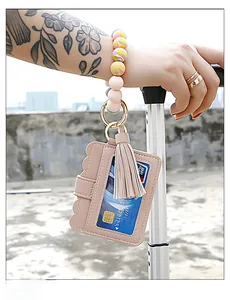 Pink silicone bead bracelet keychain with leather card holder and elegant long tassel