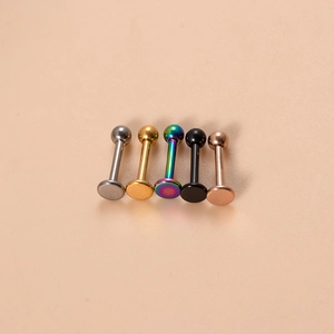 Close-up of five 16G titanium horseshoe rings in silver, gold, rainbow, black, and rose gold