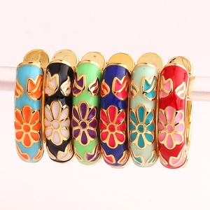 Close-up of a 6-piece set of colorful enamel flower bracelets with golden metal edges