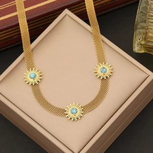 Gold mesh chain necklace featuring three sun pendants with turquoise bead inlay detail