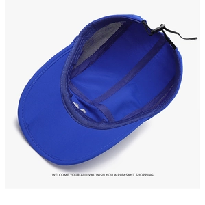 Detail view of the breathable mesh lining and adjustable strap of the blue outdoor cap