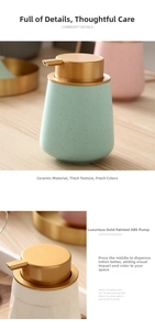 Detail of ceramic soap dispenser with gold ABS pump head on a wooden table