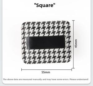 Detailed view of square houndstooth puff with dimensions 55mm by 45mm and satin ribbon