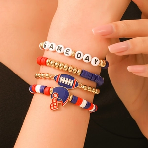 Close-up of GAME DAY beaded bracelet set with rugby charms and clay beads on wrist
