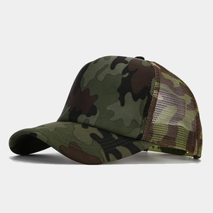 Detail of camouflage trucker hat featuring breathable brown mesh and adjustable strap back