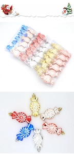 Detail view of colorful spiral candy-shaped Christmas ornaments with shiny metallic finish