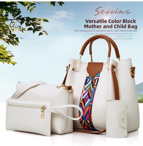 Detail shot of 4-piece white faux leather tote set with crossbody bag and clutch