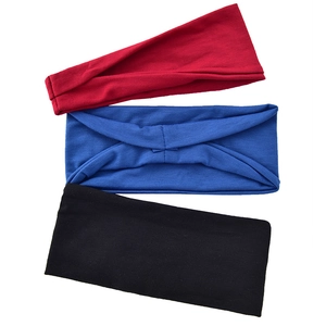 Set of three elastic sports headbands in red blue and black with twisted knot design
