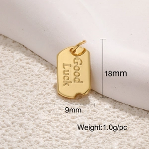 Macro shot of 18mm gold Good Luck charm pendant with size and weight dimensions