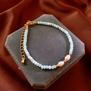 Detail of Amazonite bead bracelet with freshwater pearls and gold metal accents