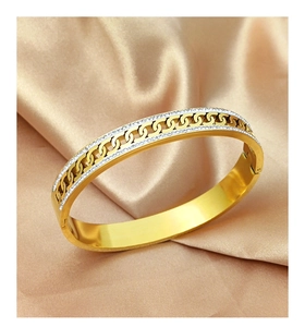 Macro shot of gold-plated titanium steel bracelet with double-row cubic zirconia inlay