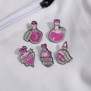 Set of five purple enamel magic potion bottle pins with motivational English quotes