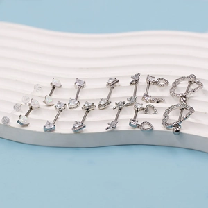 Collection of silver heart and butterfly nipple rings with opal and cubic zirconia