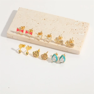Vintage gold-plated bow and floral stud earring set with zircons and enamel details