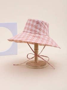 Close-up of pink and white plaid wide-brim sun hat with adjustable windproof drawstring