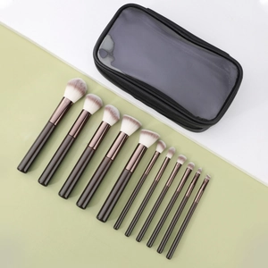 Detailed view of 11-piece makeup brush set with wooden handles and black zipper pouch