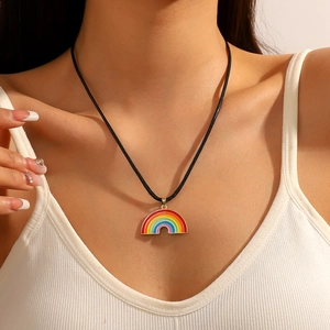 Rainbow heart magnetic pendant necklace with black cord shown on a female model