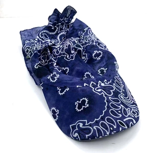 Detail view of navy blue bandana print sun visor with adjustable folding structure