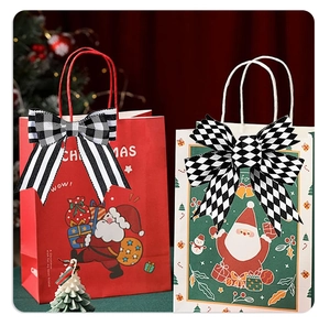 Detail of black and white plaid decorative bows on festive Christmas gift bags