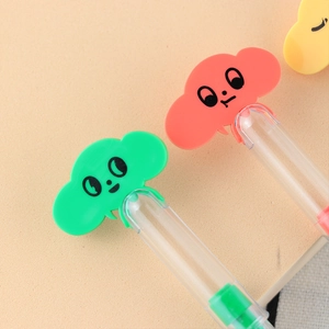 Macro shot of creative cloud-shaped pens with transparent barrels in candy colors