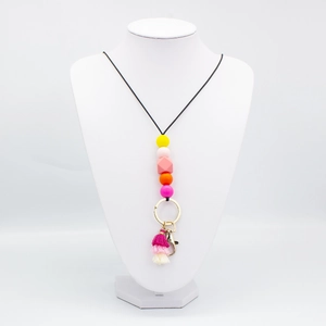 Colorful silicone bead lanyard necklace with tassel and gold clasp on a white mannequin