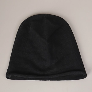 Detail of black linen knit beanie featuring breathable mesh texture and rolled edge