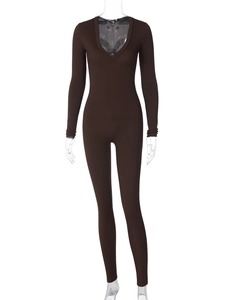 Detail of the deep V-neck and ribbed knit texture of a brown slim-fit jumpsuit
