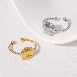Anillos de concha en acero inoxidable bañados en oro de 18K y plata con diseño trenzado