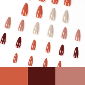 Glossy almond press-on nails in burgundy red, cream white, and dusty pink shades
